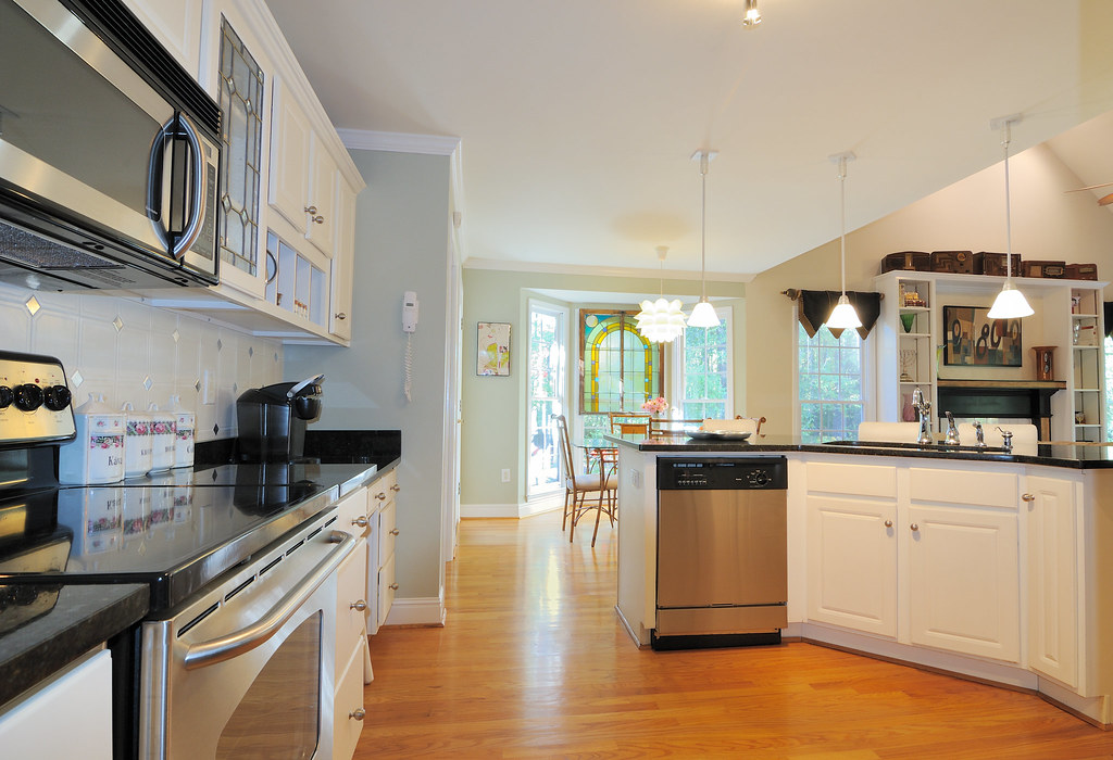 Built-in dishwasher and cooktop in a modern Falls Church kitchen