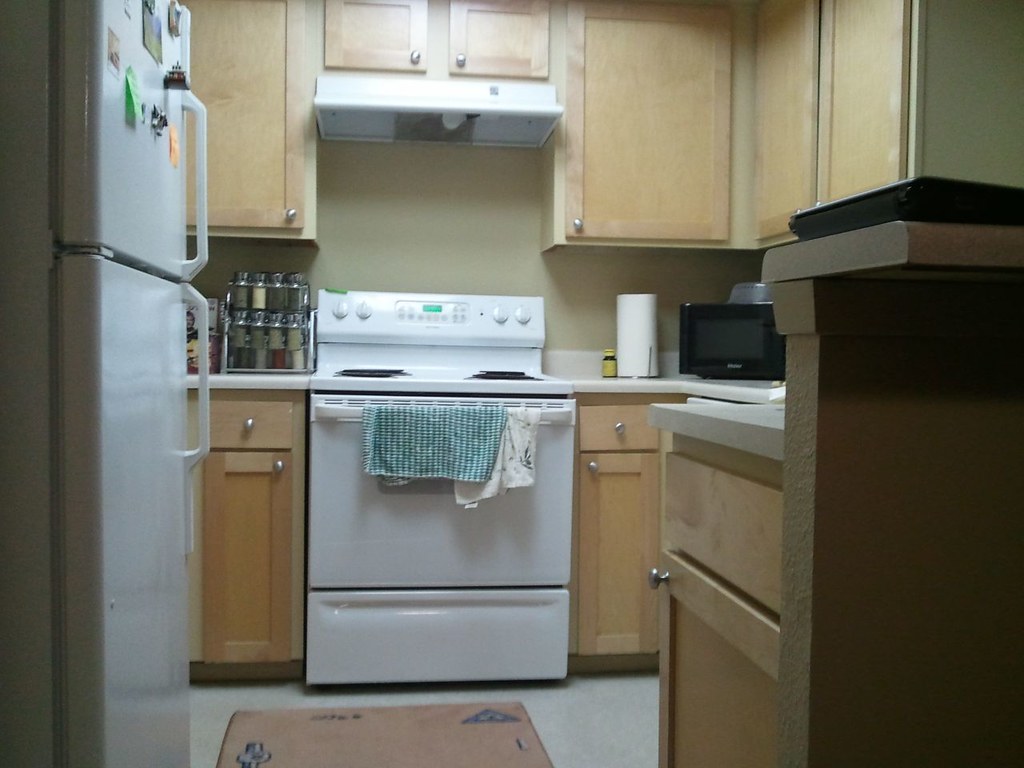 Top-load washer and matching dryer in a Falls Church home laundry area